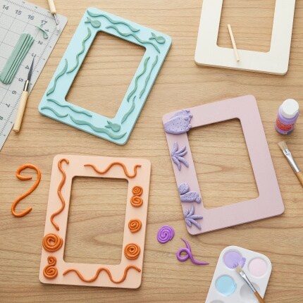 three painted wood frames