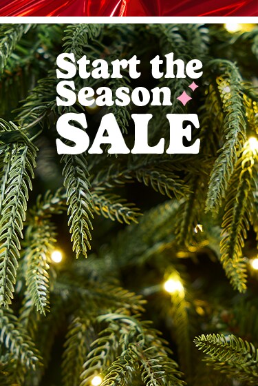 Start the season sale with Christmas tree decorated with pink and green decorations