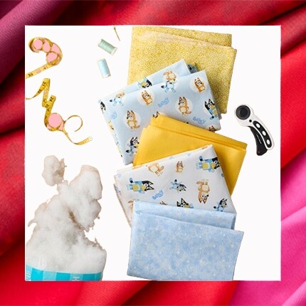 quilting fabric and batting with yellow and Bluey fabric squares