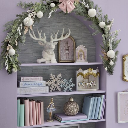 Frosted Fairytale Tabletop decorations: pastel colored decorative items on shelves.