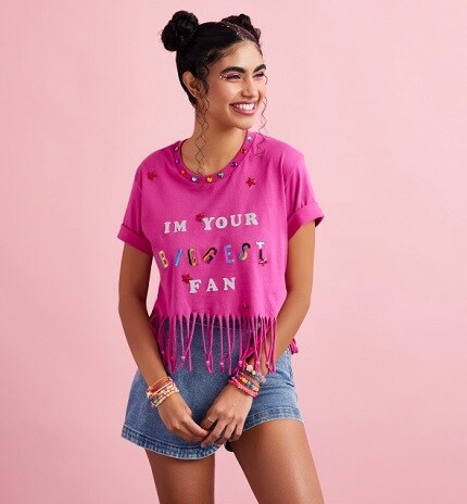 girl in pink crafted t-shirt with jean shorts