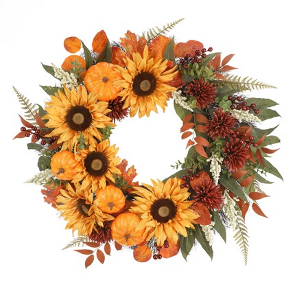 Autumn floral wreath with bright sunflowers, orange pumpkins, red berries, and leafy foliage on white, creating a warm, festive mood.
