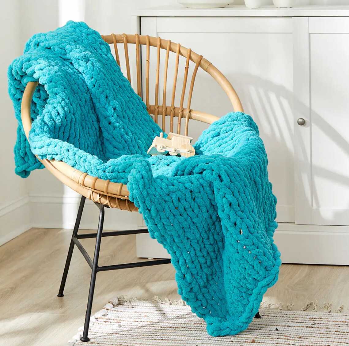 Chunky Yarn blanket draped over a chair