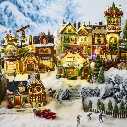 gold reindeer on wood mantel with gold holiday accents