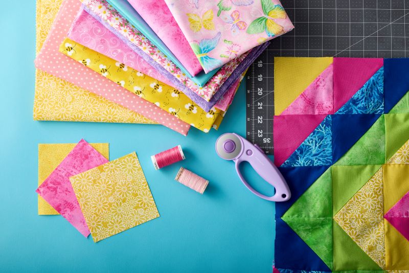 Fabric and sewing tools laid out on a table