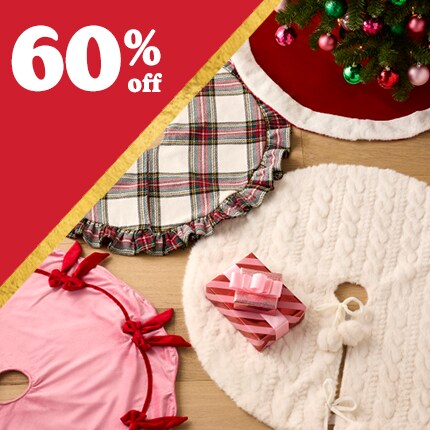 assorted tree skirts laid out and up to 60% off in white text over red triangle