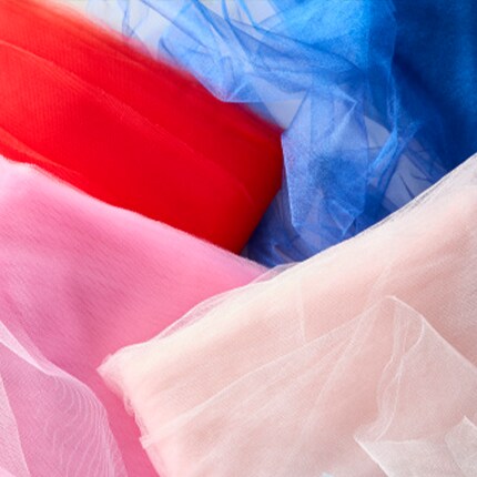 stacked folded edge of t-shirts in assorted colors