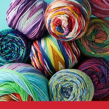 assorted skeins in colorful styles in a pile