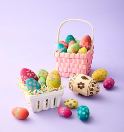 wood painted eggs in baskets