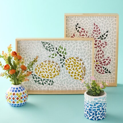 Mosaic crafts- trays and vases on blue background