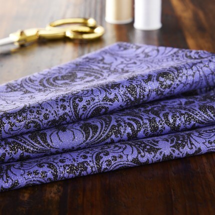 Halloween fabric in purple with spider design