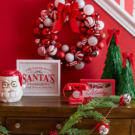 Peppermint lane decor with Red and white ornament wreath, Santa and table top trees