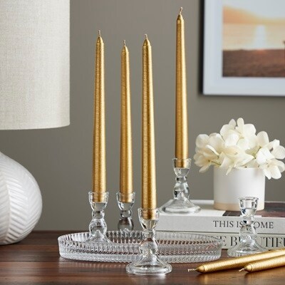 4 gold tapers in glass holders