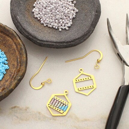 earring parts and seed beads with jewelry pliers
