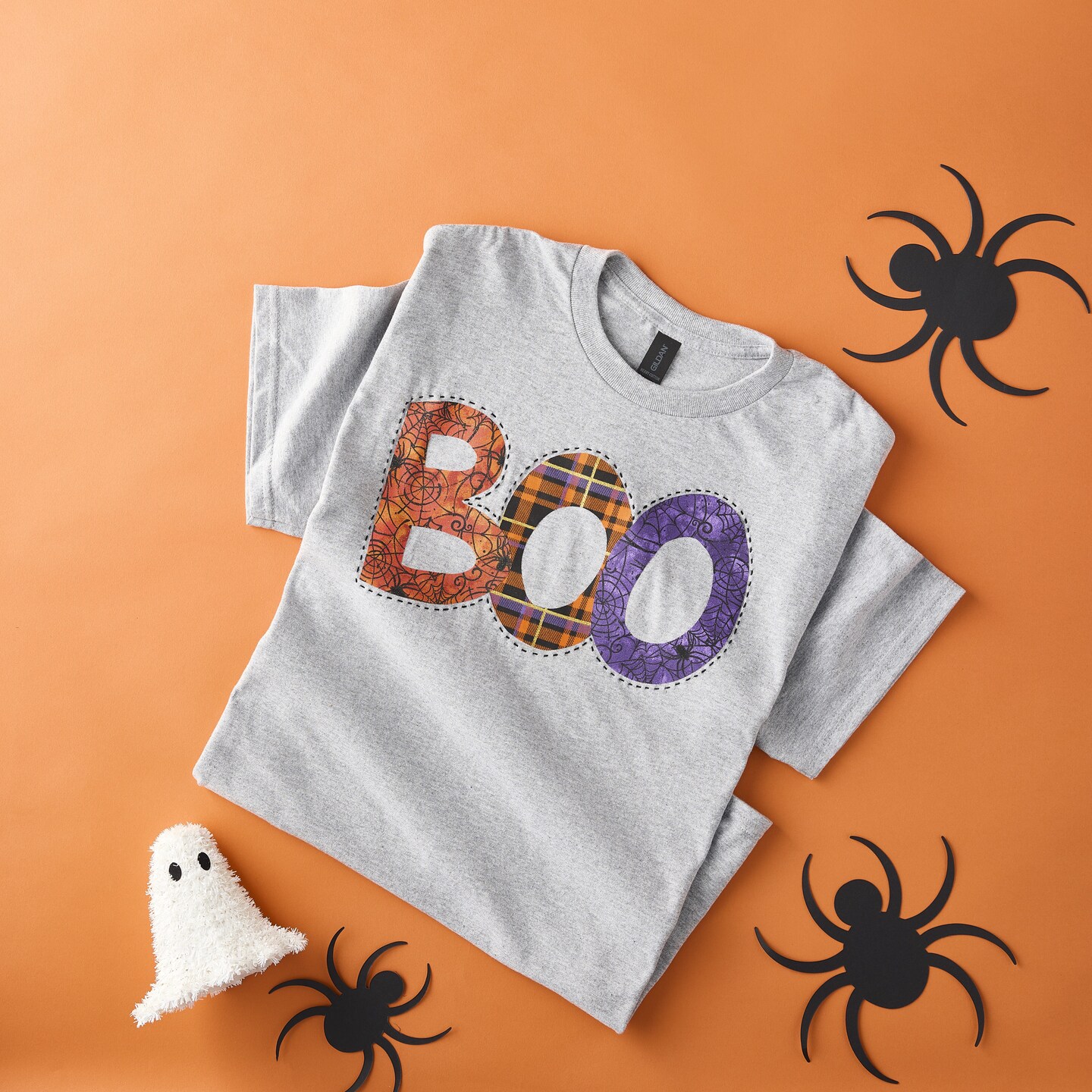 gray tshirt that says boo in orange and purple