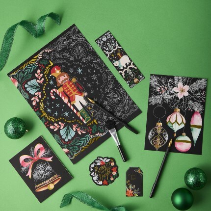 Holiday scratch art with nutcracker on green background