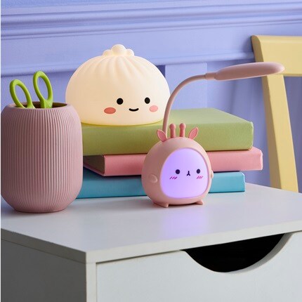 Night lights sitting on a desk