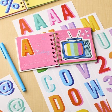 Colorful letter stickers on table