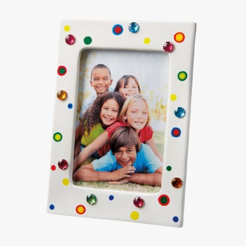 White picture frame with gems around the picture opening. 
