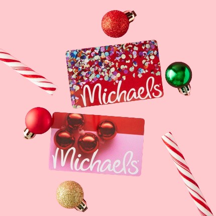 two holiday themed gift cards on pink background