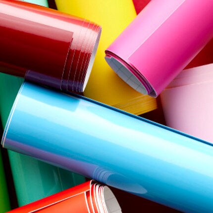assorted rolls of vinyl and sticker sheets