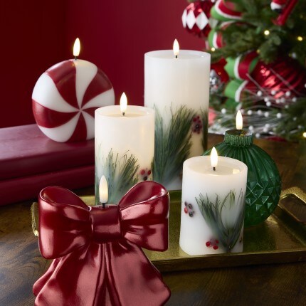 LED Christmas Candles including peppermint, red bow, and 3 white mistletoe printed pillar candles 