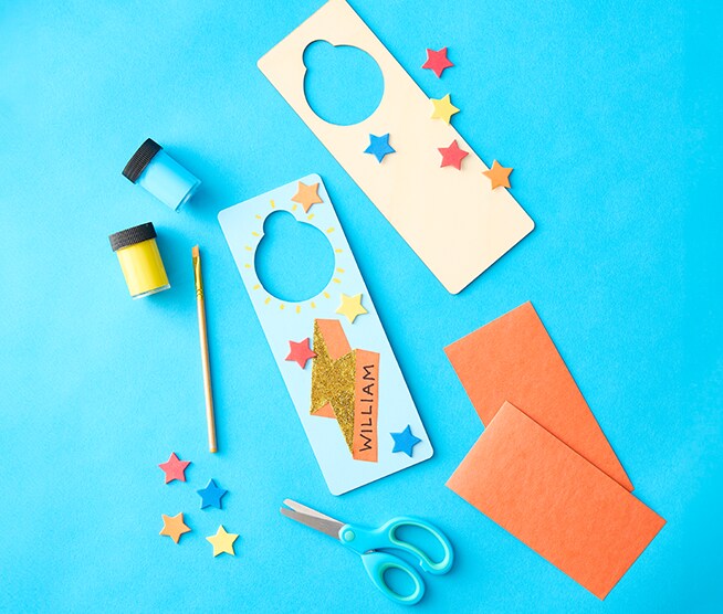 Image of a colorful door hanger and craft supplies