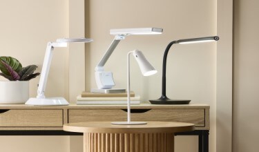four ottlite lamps on two tables