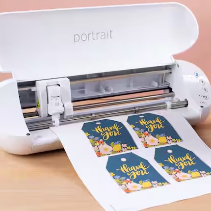 A digital cutting machine cuts tags on paper.