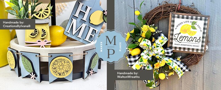 MakerPlace by Michaels A decorative setup featuring lemon-themed crafts. On the left, a "HOME" banner with lemons; on the right, a wreath with lemons and a sign. Vibrant and cheerful.