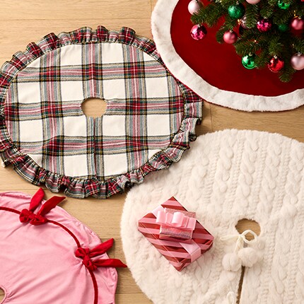 Christmas Tree Skirts & Collars: plaid, pink with red bows, white with two pompons and one red with a white border