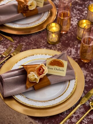 gold charger and plate table setting with brown napkin and fall colors