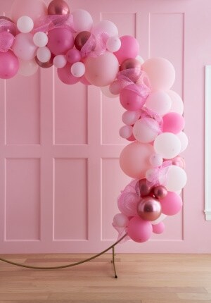 pink balloons in assorted shades on gold hoop 