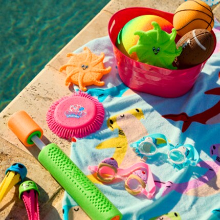 Kids outdoor toys and games by a pool