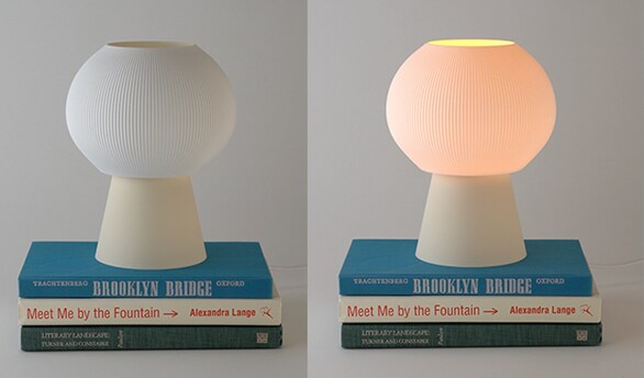 video still of lamp on books