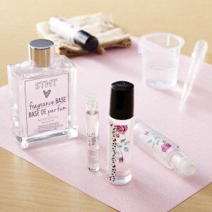 Body oil and lip gloss on a desk