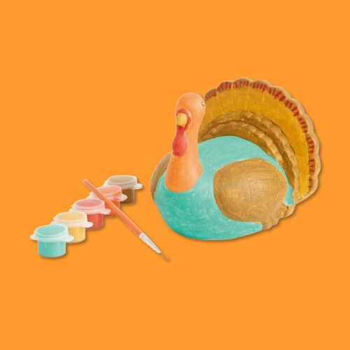 Ceramic turkey with 6 pot paint with a paint brush. 
