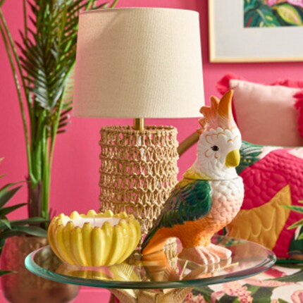 Hothouse decor side table with banana candle and parrot tabletop decor with a lamp