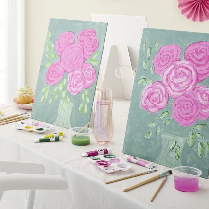two paintings of pink flowers on table