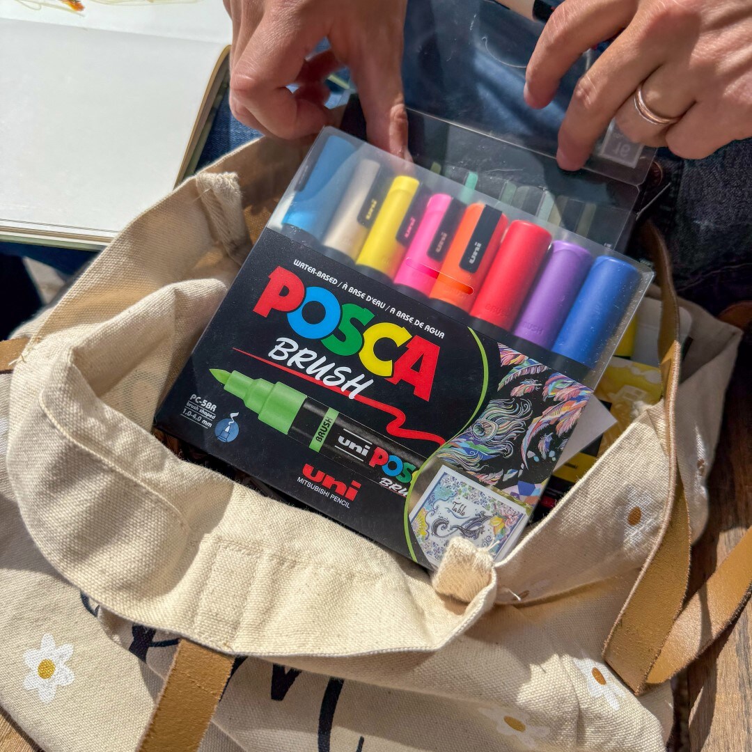 black background with colorful Posca marker colors dripping down it