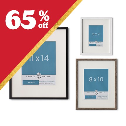 four wood frames with cream matts overlapping sides on red background with red and pink abstract printts