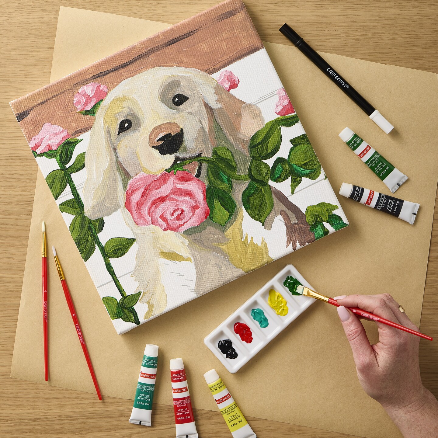 Canvas Painting Kits of white Labrador retriever holding pink flowers in his mouth 