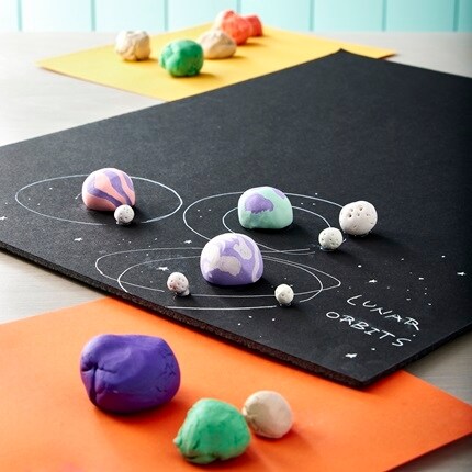 project board with clay on the board. 