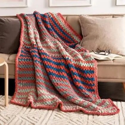 Image of an orange and blue crochet blanket