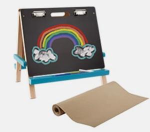 chalkboard easel with a rainbow drawn on it and paper roll