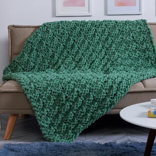 Image of a dark green knit blanket