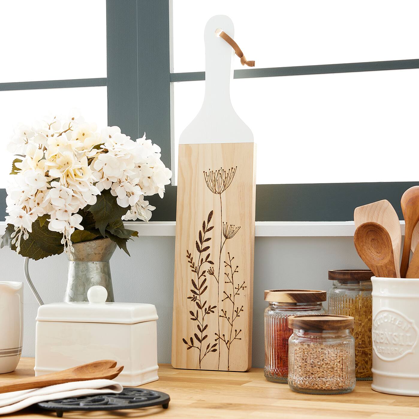 Cutting board with wood burned flower design