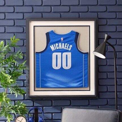 A Dallas Mavericks jersey framed on a wall