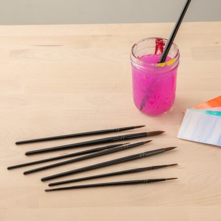 Black Watercolor paint brushes on table