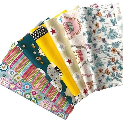 folded fabrics fanned out in a variety of patterns